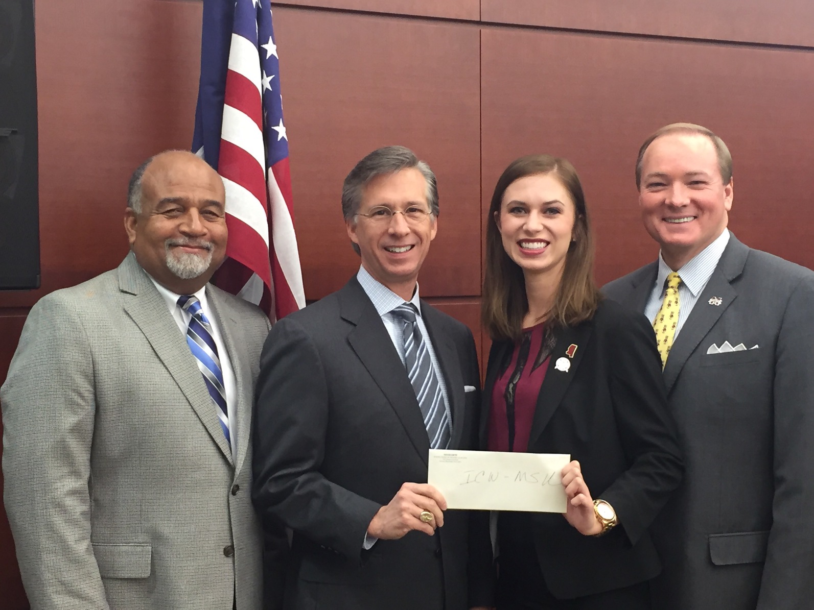 AT&T Mississippi President Mayo Flynt (second from left) and External Affairs Director CD Smith (far left) present Mississippi State University President Mark Keenum and Student Association President Roxanne Raven with a $1,000 contribution in honor of raising awareness of distracted driving dangers. (Photo submitted)