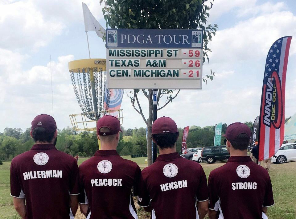 The MSU men’s disc golf club takes in the scoreboard showing the Bulldogs as winners of the National Collegiate Disc Golf Championship. (Submitted photo)