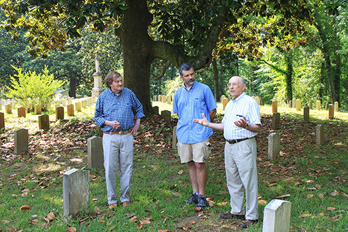 Mississippi State Giles Distinguished Professor of History Emeritus and Executive Director of the Ulysses S. Grant Association John Marszalek, right, speaks during Thursday’s [May 24] announcement of an initiative to locate unmarked Union soldiers graves in Friendship Cemetery in Columbus. Looking on is Columbus historian and writer Rufus Ward, left, and Tony Boudreaux, director of the University of Mississippi Center for Archaeological Research. (Photo by Isa Stratton)