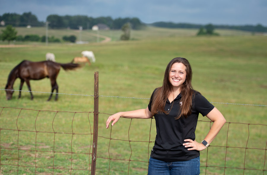 Portrait of Melissa Inmon with a horse in the background