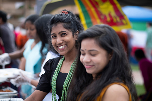 A woman smiles at the International Fiesta