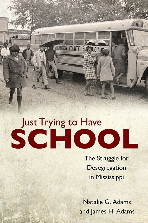 Book cover featuring African-American students walking near and boarding a Wilkinson County school bus.