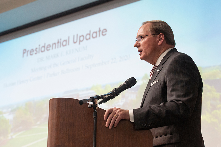 MSU President Mark E. Keenum speaks at a podium during the fall general faculty meeting.