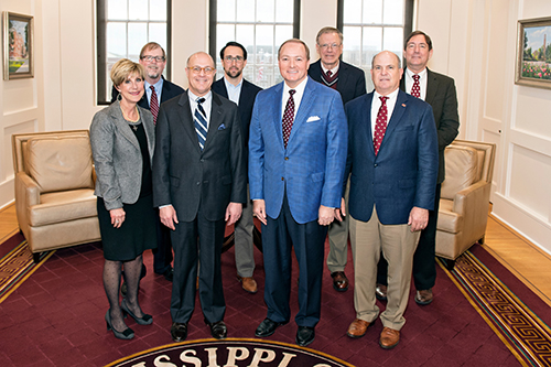 Mississippi State University hosted J. Christopher “Chris” Giancarlo, chairman of the U.S. Commodity Futures Trading Commission, for a campus visit this week [Dec. 5-6]. Pictured, front row from left, are MSU College of Business Dean Sharon Oswald; Giancarlo; MSU President Mark E. Keenum; and Mississippi Farm Bureau Federation President Mike McCormick. Second row, from left: Keith Coble, head of MSU’s Department of Agricultural Economics; Charlie Thornton, director of the CFTC’s Office of Legislative Affairs; Reuben Moore, interim associate vice president of MSU’s Division of Agriculture, Forestry and Veterinary Medicine; and Greg Bohach, vice president of MSU’s Division of Agriculture, Forestry and Veterinary Medicine. (Photo by Beth Wynn)