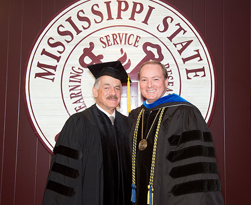 Sebastião Barbosa, left, is being named president of the Brazilian equivalent of the U.S. Department of Agriculture—the Brazilian Agricultural Research Corp., or EMBRAPA. He is pictured with MSU President Mark E. Keenum at the university’s 2014 spring commencement ceremonies, during which an honorary Doctor of Science degree was conferred on Barbosa because of his work in worldwide food security issues. (Photo by Beth Wynn)
