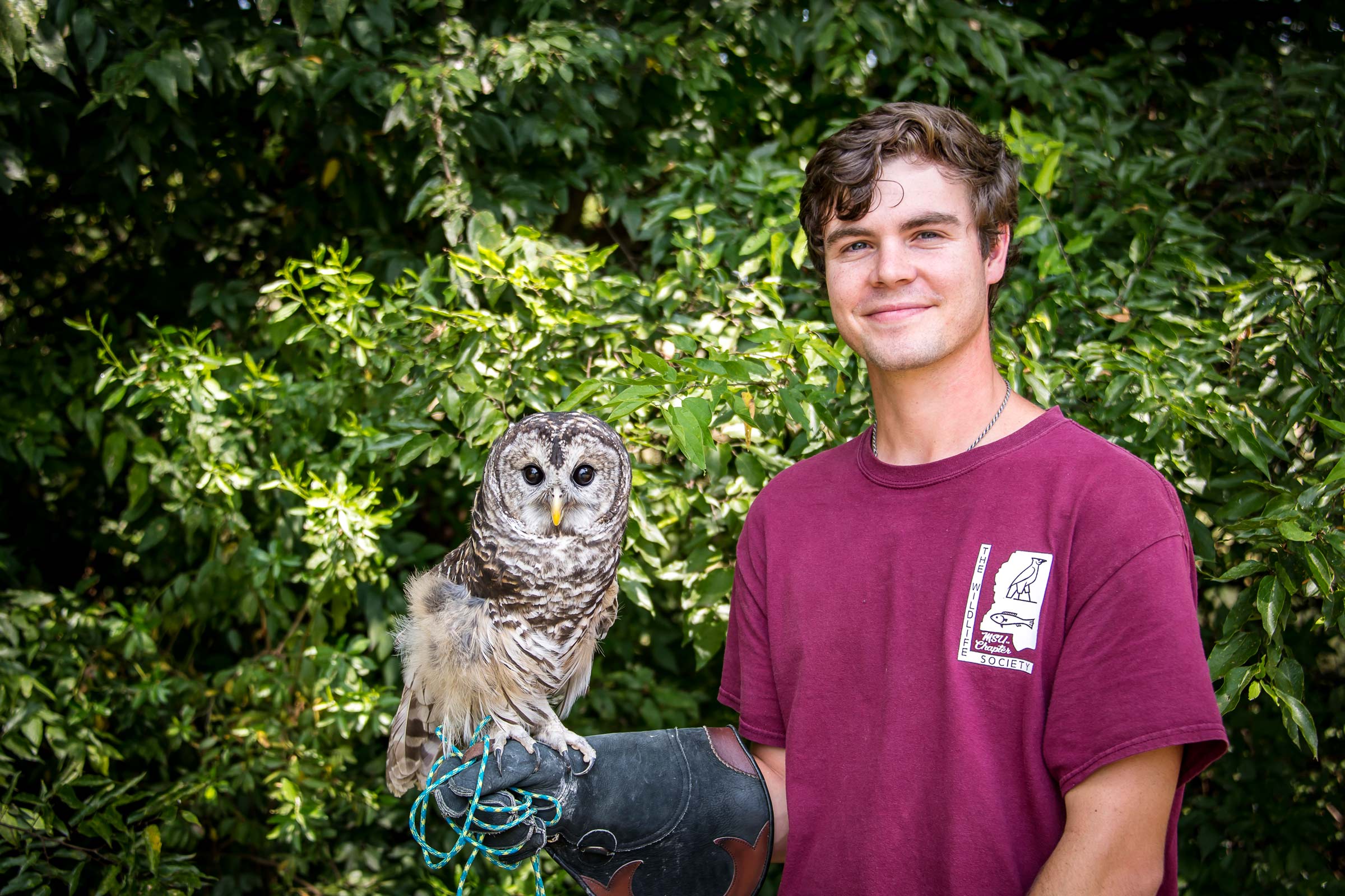 Carson Kitaif, pictured holding an owl.