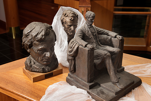 Statues of Abraham Lincoln, part of the Frank J. and Virginia Williams Collection of Lincolniana, are unpacked at Mississippi State’s Mitchell Memorial Library. (Photo by Megan Bean)
