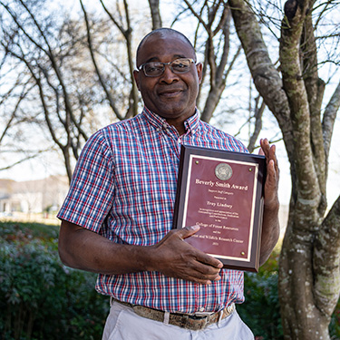 Troy Lindsey with his award