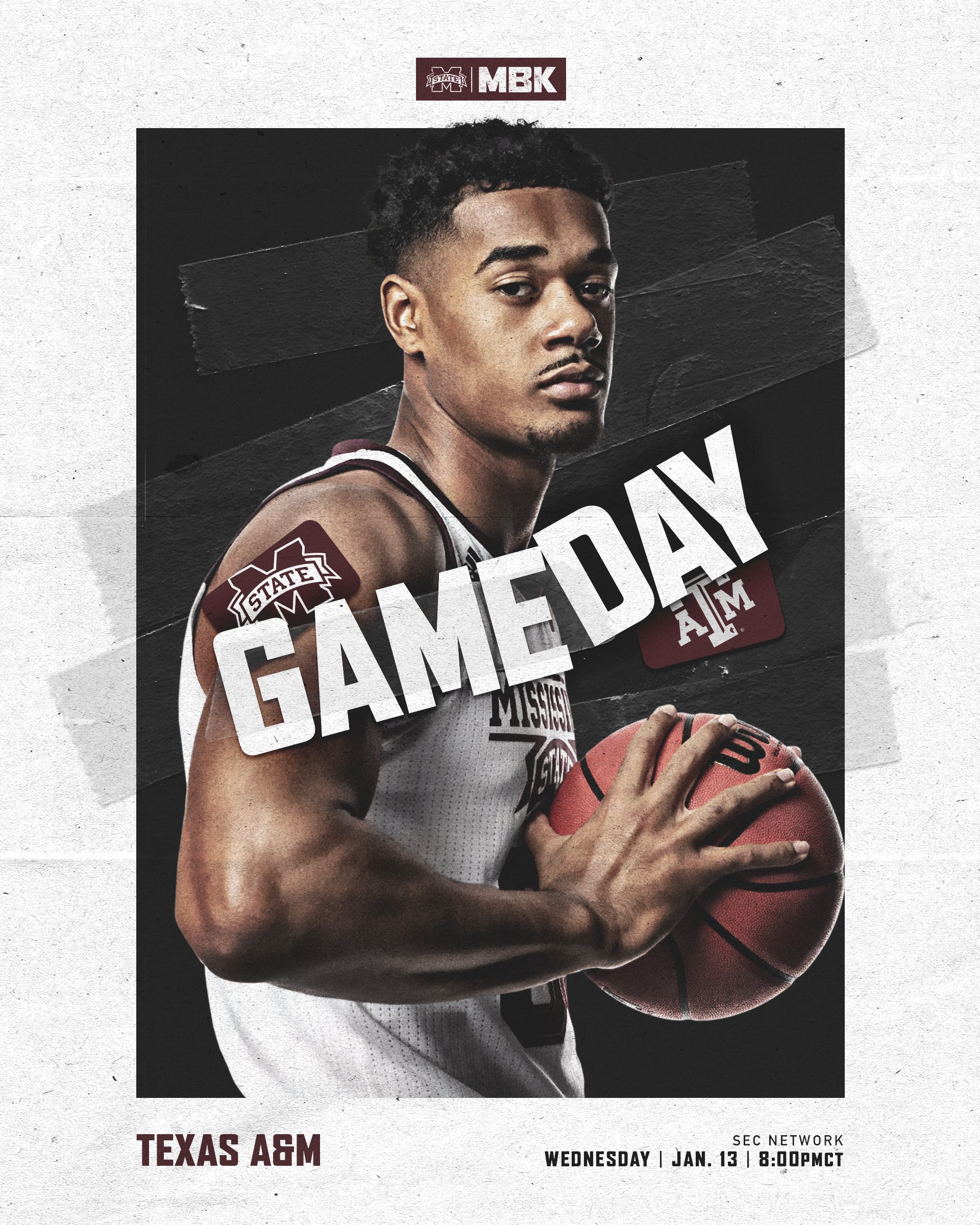 Mississippi State men's basketball player Tolu Smith stares at the camera while holding while holding an orange Wilson basketball.