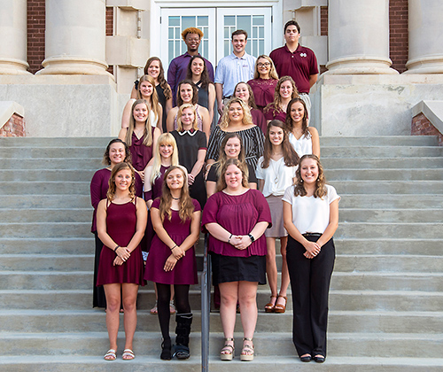 A group photo of 22 students who are among recipients of the METP scholarship. They are pictured standing on the steps of Lee Hall.