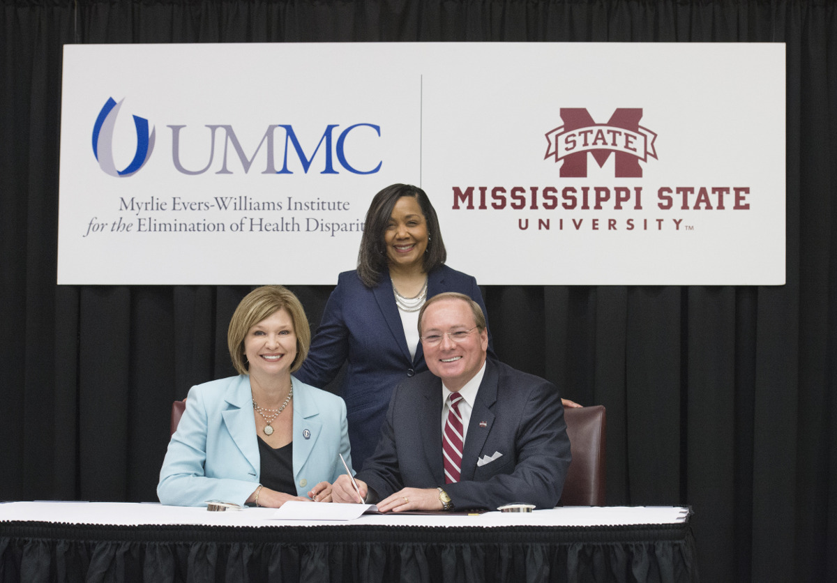 Mississippi State President Mark E. Keenum, right, and University of Mississippi Medical Center Vice Chancellor for Health Affairs Dr. LouAnn Woodward signed a Memorandum of Understanding today [April 18] to formalize a partnership addressing many of the state’s most critical health care challenges. Looking on is Dr. Bettina Beech, UMMC’s associate vice chancellor for population health and executive director of the Myrlie Evers-Williams Institute for the Elimination of Health Disparities, which is working to expand existing collaborations and pursuing new opportunities between these higher education institutions.