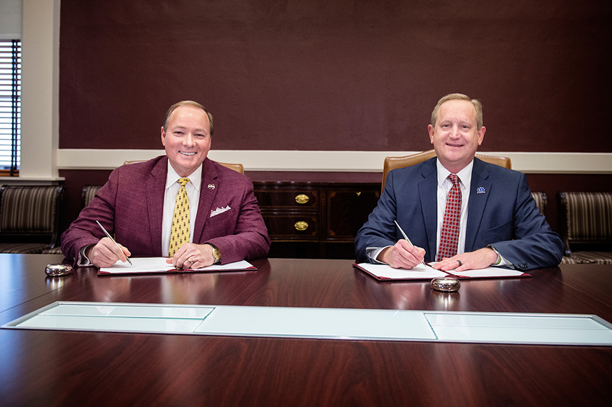 Mark Keenum and Jay Allen sign an MOU between MSU and ICC.