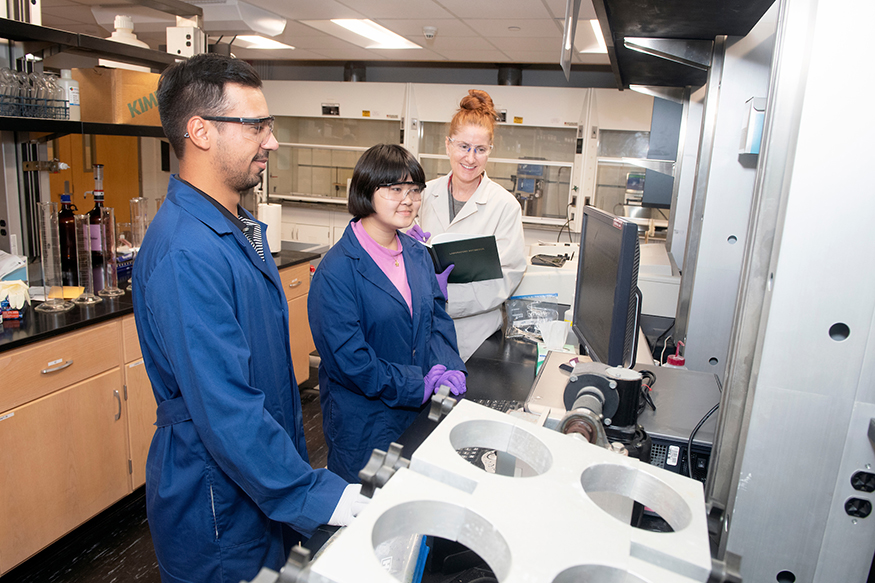 Students and faculty members analyze results in an MSU lab.