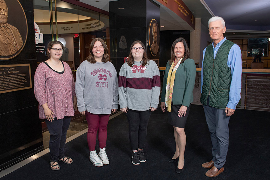 Pictured left to right: Water Valley High School Librarian Jennifer Rotkiewicz; WVHS students Addison Sossaman and Madalyn Stevens; MSU Professor and Dean of Libraries Lis Pankl; and Executive Vice Provost and Dean of the Graduate School Peter Ryan. 