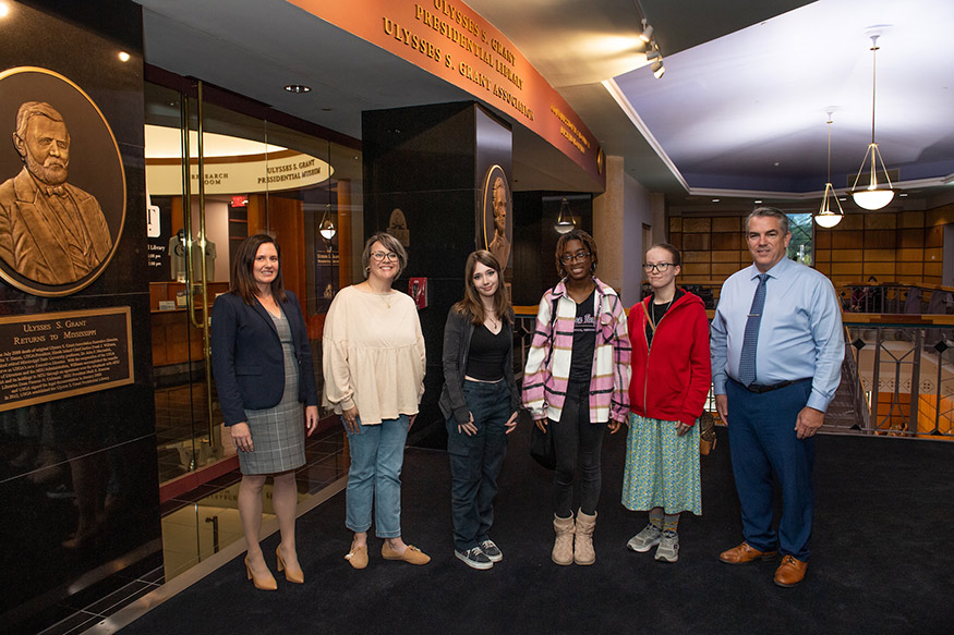 Pictured left to right: MSU Professor and Dean of Libraries Lis Pankl; Northeast Lauderdale High School Librarian Casey Clarke; NEHS students Emma Crocker, Talabria Lockhart and Elizabeth Robbins; and Associate Vice President for Academic Affairs Jim Dunne. 