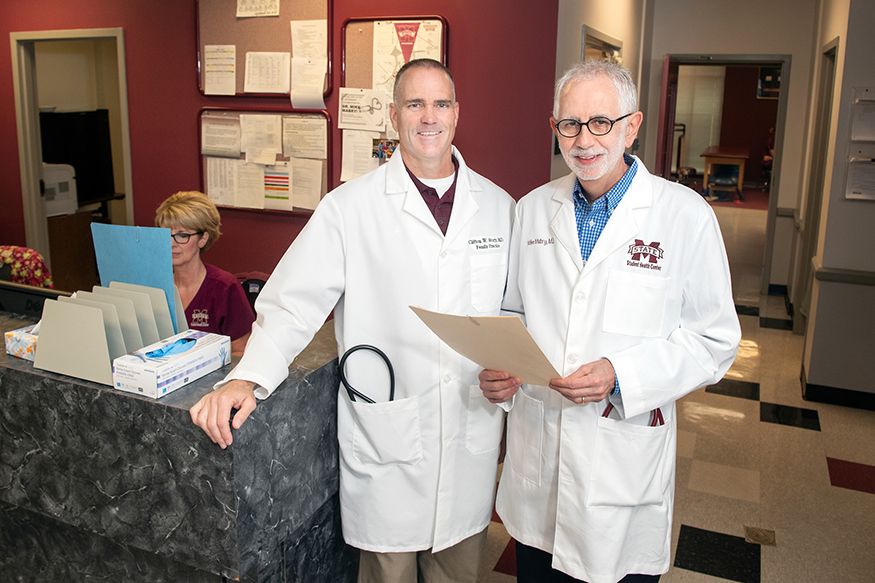 Dr. Cliff Story, left, stands with Dr. Mike Mabry at MSU’s Longest Student Health Center. Mabry is referring patients to Story and other doctors on campus as he prepares to retire from MSU May 1 after serving as a university physician for nearly 40 years. (Photo by Beth Wynn)