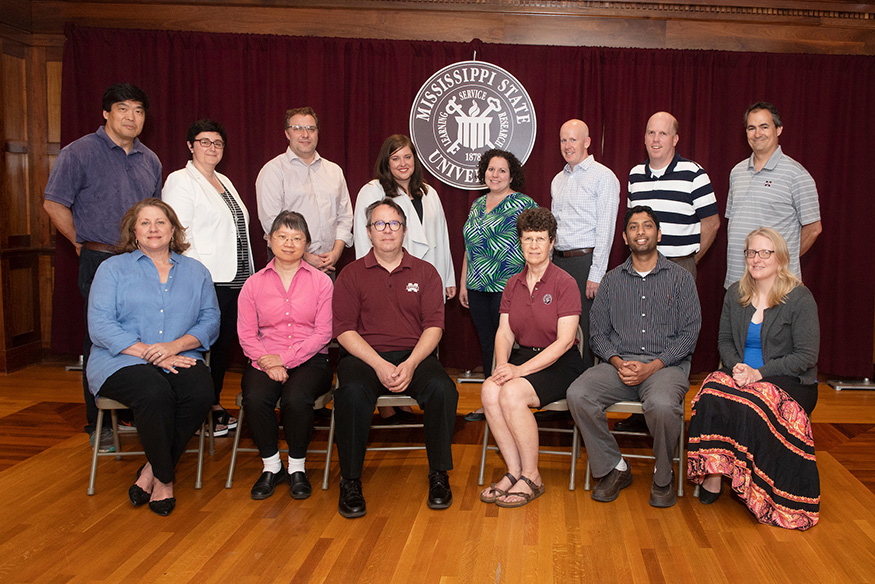 Fourteen Mississippi State faculty members recently completed the university’s Maroon Institute for Writing Excellence program aimed at improving undergraduate writing skills. The new graduates include (standing, left to right) Hui Wan, Iva Ballard, Andrew Tripp, Patty Ann Bogue, Lindsey Peterson, Michael Seymour, Gregg Twietmeyer, Matthew Zimmerman; (seated, left to right) Gay Williamson, Ling Li, Richard Human, Amelia Fox, Varun Paul and Margaret Ralston. (Photo by Beth Wynn)