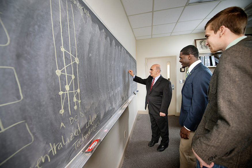 Mohsen Razzaghi, left, professor and head of MSU’s Department of Mathematics and Statistics, is pictured with Chartese Jones, middle, an MSU doctoral student soon traveling to study at the University of Bucharest, and Victor Holotescu, right, a visiting Romanian scholar from the University Politehnica of Timisoara, who is studying at MSU this spring. (Photo by Megan Bean)