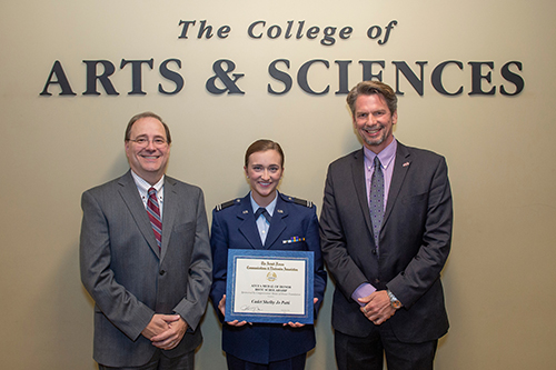 Rick Travis, dean of MSU’s College of Arts and Sciences, left, and Dennis Smith, head of the chemistry department, right, honored Shelby Patti on Oct. 23 with a reception in recognition for her receiving the prestigious Armed Forces Communications and Electronics Association ROTC Medal of Honor Scholarship. (Photo by Logan Kirkland)