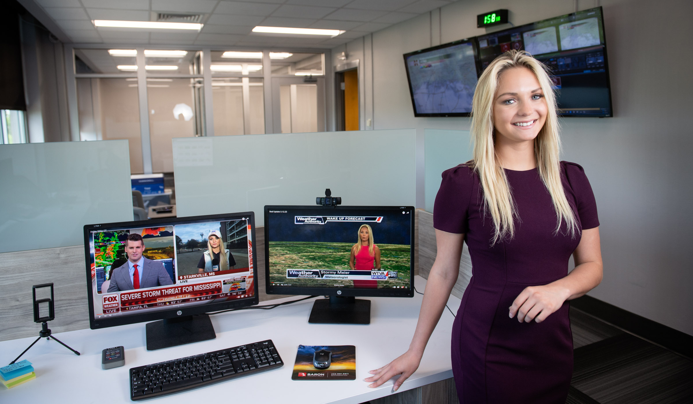 Haley Meier, pictured next to a desk in a studio environment