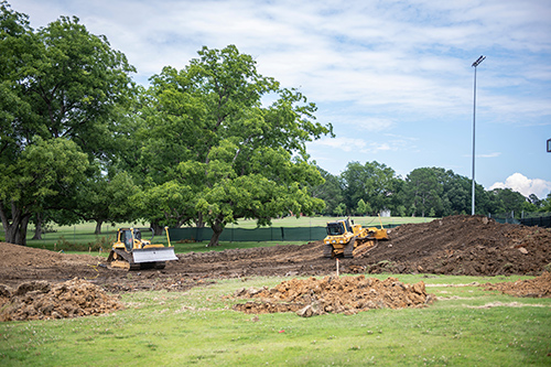 Bulldozers are seen on a construction site.