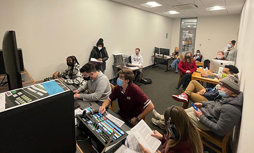 MSU students work on a broadcast journalism program with studio equipment