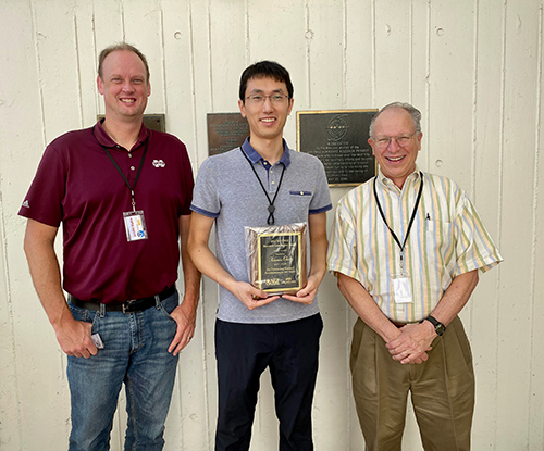 Pictured with Xiaomin Chen, center, a 2022 recipient of the MSU Northern Gulf Institute Research Award, are NGI Associate Director Jamie Dyer, left, and NGI Director Robert Moorhead, right. 