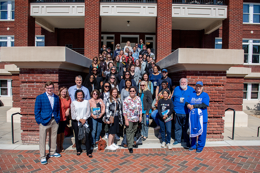 National Student Exchange program coordinators pose at the steps of Mississippi State’s historic YMCA Building Tuesday [Oct. 17]. 