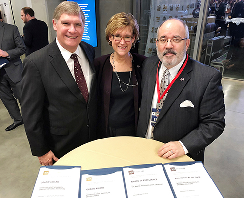 Mississippi State University’s Office of Public Affairs (OPA) was recently honored by the Council for Advancement and Support of Education (CASE) District III with the Platinum Award — the CASE III competition’s top prize — for its “We Ring True” branding initiative, along with a Grand Award and two Awards of Excellence, during organization’s annual conference in Atlanta, Georgia. Competing against 125 public and private higher education institutions in nine Southeastern states comprising District III, MSU emerged as the region’s top recipient for its strategic initiatives in communications and marketing. Shown receiving the awards for OPA were MSU’s Checky Herrington, OPA creative director and marketing research analyst; Harriet V. Laird, OPA associate director; and Sid Salter, OPA director and MSU’s chief communications officer. (Photo submitted) 
