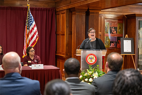 Regina Hyatt speaks at the podium during the One Pill Can Kill campaign event at MSU.