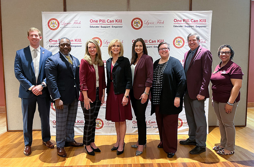 From left, Joseph McClatchy, Public Education and Community Engagement, Office of the Attorney General; Col. Stephen Maxwell, Director, Mississippi Bureau of Narcotics; Wendy Bailey, Executive Director, Mississippi Department of Mental Health; Attorney General Lynn Fitch; Joan Lucas, MSU General Counsel; Regina Hyatt, MSU Vice President for Student Affairs; Jeremy Baham, MSU Associate Vice President for Student Affairs; and Santee Ezell, Director, MSU Office of Health Promotion and Wellness.