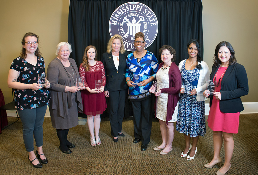 At an MSU ceremony this week, the President’s Commission on the Status of Women presented its 2016 Outstanding Women Awards. Featured speaker was Allison Pearson (fourth from left), interim associate vice president for academic affairs. The seven honorees included (from left) Bailey McDaniel, Anne Buffington, Courtney Headley, Sharon Avant, Sarah Lee, Vineetha Menon and Kennedy Brown. (Photo by Megan Bean)