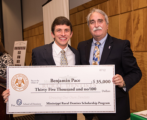 Ben Pace of Philadelphia is congratulated by Dr. David Felton, dean of the UMMC School of Dentistry, for receiving a Mississippi Rural Dentists Scholarship. (Photo submitted)