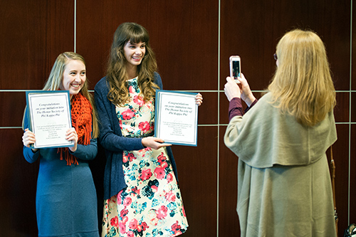 After being inducted into the Honor Society of Phi Kappa Phi and receiving the Junior Class Phi Kappa Phi scholarship, Avery Palmer, a junior accounting major from Marietta, Georgia, and Rebecca Smith, a junior veterinary medical technology major from Byhalia, take a celebratory picture for Smith’s mother, Carol. Nearly 130 new members were recently inducted into MSU's chapter of the honor society, which is the nation's oldest, largest and most selective honor society for students in all academic disciplines. (Photo by Russ Houston)