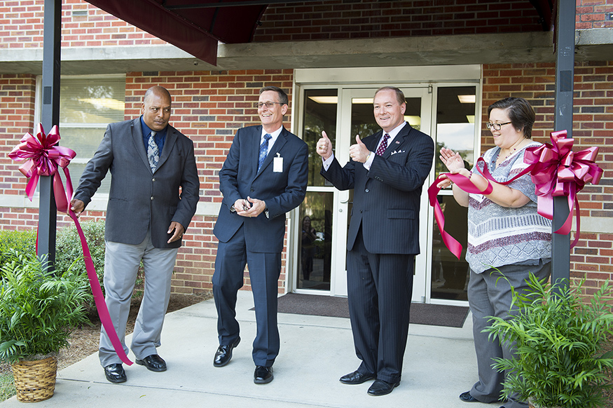 MSU officials celebrate the opening of the MSU Police Department’s new emergency communications center. Pictured, from left to right, are MSUPD Assistant Chief Kenneth Spencer, Chief of Police Vance Rice, MSU President Mark E. Keenum and MSU Vice President for Student Affairs Regina Hyatt. (Photo by Russ Houston)