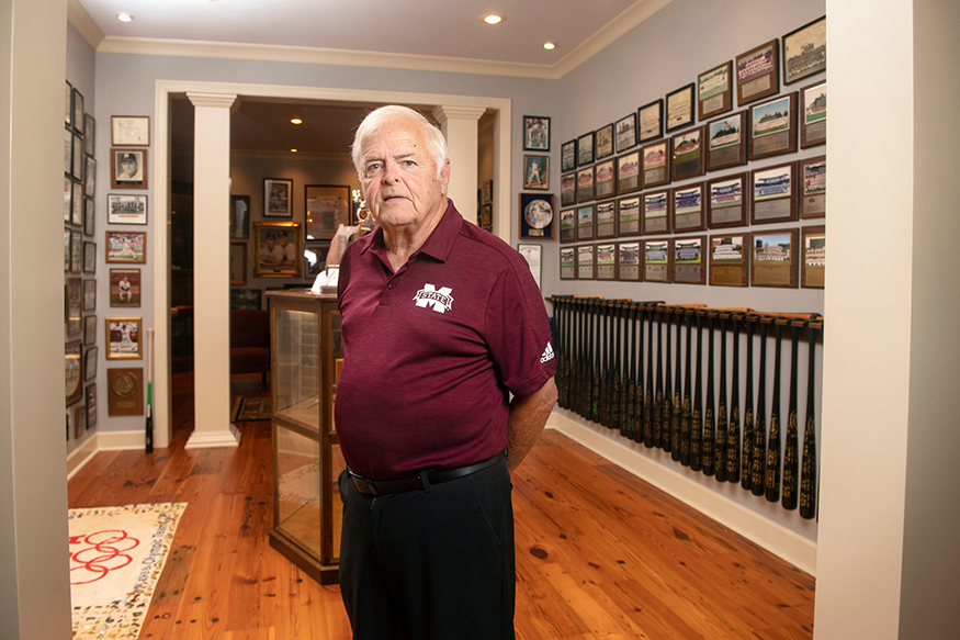 Ron Polk, pictured inside his home surrounded by baseball memorabilia. 