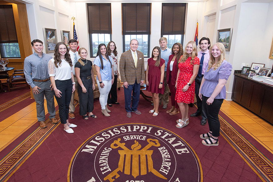 Mississippi State’s Presidential Partnership Scholars—all graduates of the state’s community college system—are shown with MSU President Mark E. Keenum, center. They are, left to right, Bradley Stines, Poplarville; Leah Pennington, Randolph; Kurtis Hare, Boonville; Joy St. Clair, Collinsville; Delaney Cooley, Ellisville; Mary Landsgaard, Olive Branch; Anna Tyson, Meadville; Nathan Holified, McComb; Tykerria Jones, Starkville; Bethany Biggers, Canton: Eli Finnegan, Decatur; Julie Stepp, Myrtle. Not pictured are Rachel Carr, Belzoni; and Sarah Rice, Moss Point. 