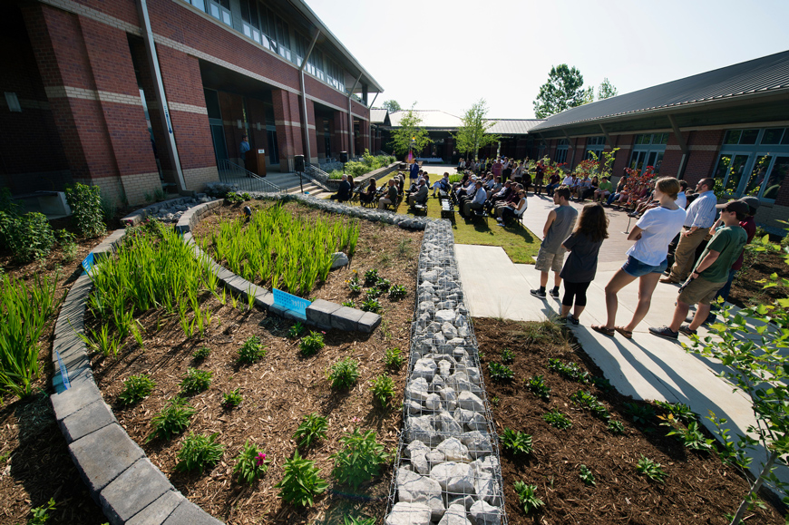 As a climax to Earth Week at MSU, faculty, staff and students gathered at the Landscape Architecture Facility to commemorate a new raingarden with a ribbon cutting and to celebrate the first planting of MSU’s community garden. (Photo by Megan Bean)
