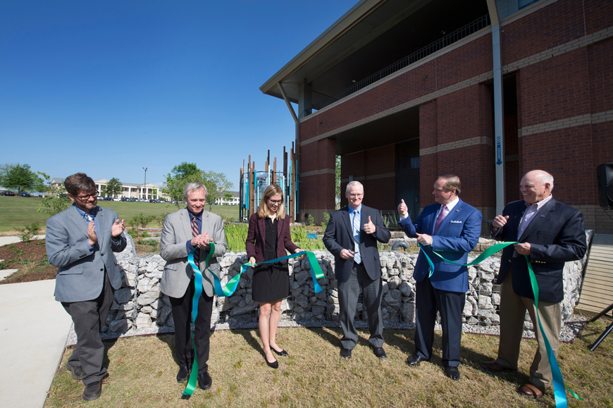 Mississippi State held a ribbon cutting for the most comprehensive raingarden demonstration project in the state April 21. Pictured (left to right) are Cory Gallo, landscape architecture associate professor; Jim West, dean of the College of Architecture, Art and Design; Roxie Raven, MSU Student Association president; Christopher B. Thomas, pollution control chief for EPA's Georgia-based Southeast region; MSU President Mark E. Keenum; and George Hopper, dean of the College of Agriculture and Life Sciences. (Photo by Megan Bean)