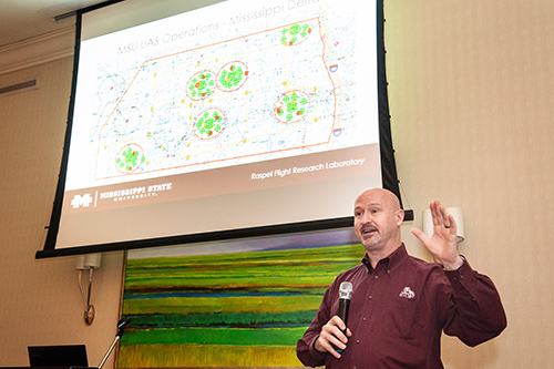 Dallas Brooks, director of the Raspet Flight Research Laboratory at Mississippi State, speaks to community, state and federal partners during the March 8 launch of MSU’s unmanned aircraft systems Delta Region Initiative. (Photo by Megan Bean)