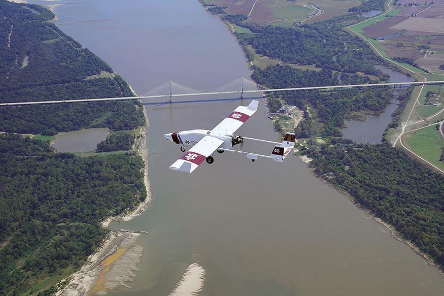 An MSU-branded UAS flies over the Mississippi River near Greenville