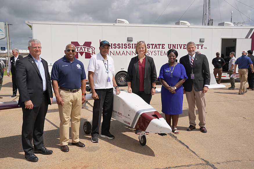MSU and JMAA personnel pictured next to a unmanned aircraft.