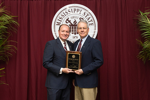 MSU President Mark E. Keenum, left, presents Steve Demarais with Mississippi State’s highest research honor, the Ralph E. Powe Research Excellence Award, during the university’s annual research awards banquet at the Hunter Henry Center on March 29. Demarais is a Dale Arner Distinguished Professor and the Taylor Chair in Applied Big Game Research and Instruction in the wildlife, fisheries and aquaculture department. (Photo by Logan Kirkland)