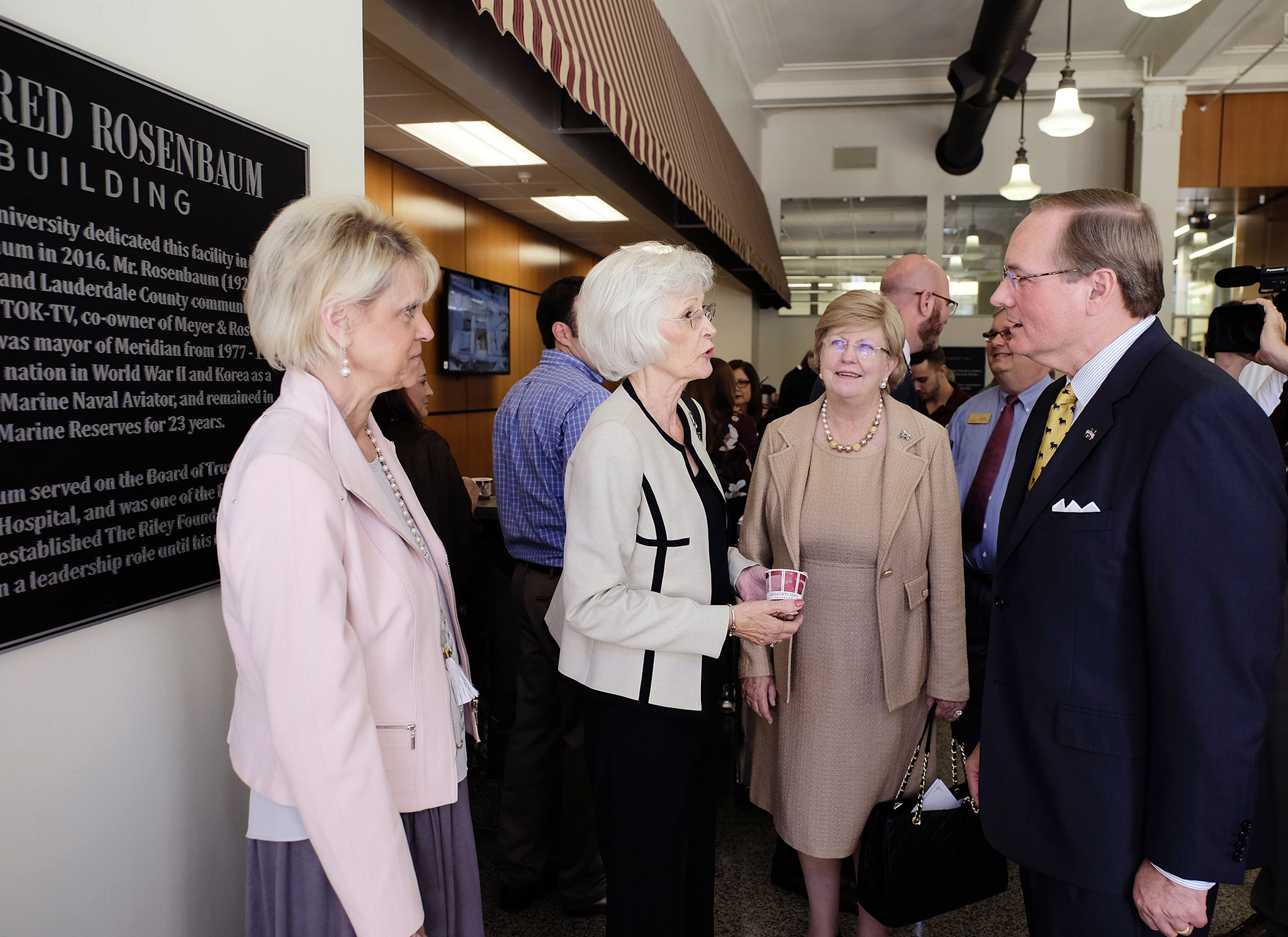 From left, Lauren Rosenbaum Brown of Jackson and Ann Stewart of Meridian, daughters of the late I.A. “Alfred” Rosenbaum, talk with MSU Provost and Executive Vice President Judy Bonner and MSU President Mark E. Keenum during Monday’s naming ceremony for the Rosenbaum Building located on the Mississippi State University-Meridian Riley Campus. (Photo by Russ Houston)