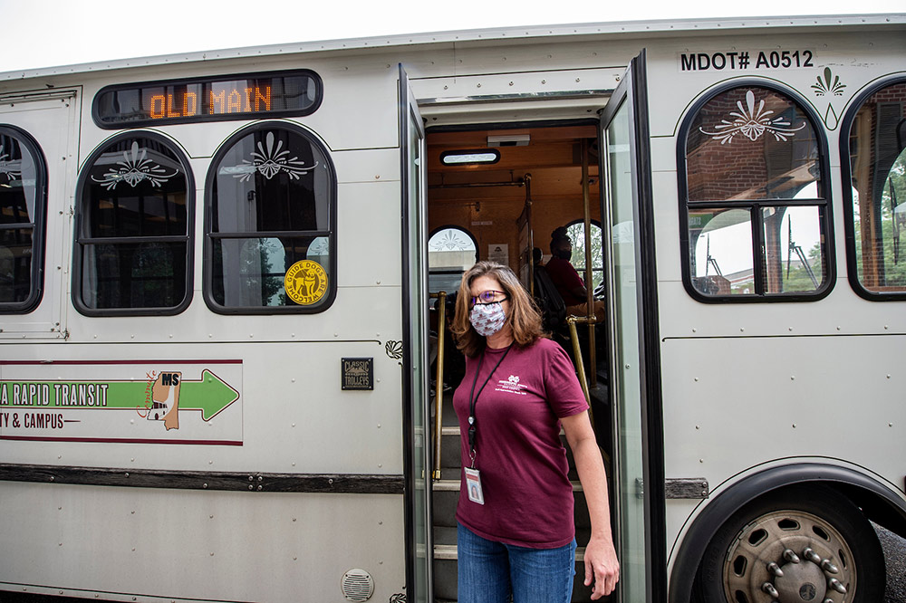 A S.M.A.R.T. passenger wears a face covering while riding on a local route.
