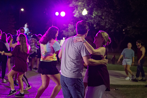 People dance at a past Salsa in the Streets event at MSU