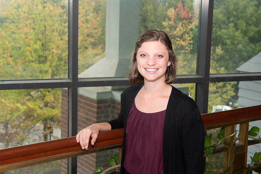 Samantha Seamon stands in front of a window in MSU's Thompson Hall