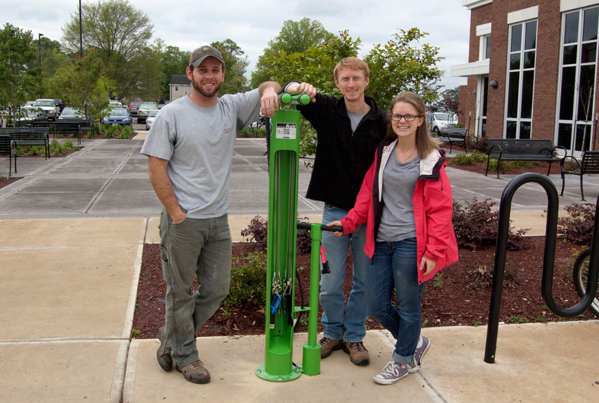 Mississippi State students Preston Sorrell, Michael Keating and Abbey Wallace pose with one of the new campus bike repair stations being installed as part of MSU’s Earth Day observation. All are enrolled in the university’s landscape architecture and landscape contracting academic programs. (Photo submitted)