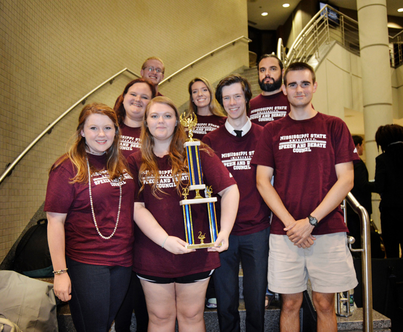 Members of MSU’s Speech and Debate Council returned with multiple honors from a recent intercollegiate competition at the University of Southern Mississippi in Hattiesburg. Accompanied by second-year adviser and speech coach Cheryl Chambers (third row, center), the MSU team includes (first row, l-r) Julia Rachel Kuehnle, Athena Kavanagh, Parker Krag, (second row) Colleen Mcinnis, Josh McCoy, (third row) William Bonduris, (Chambers) and Doug Bedsaul. Not pictured is Mackenzie Ellis. (Photo submitted by Daniel Rayborn)