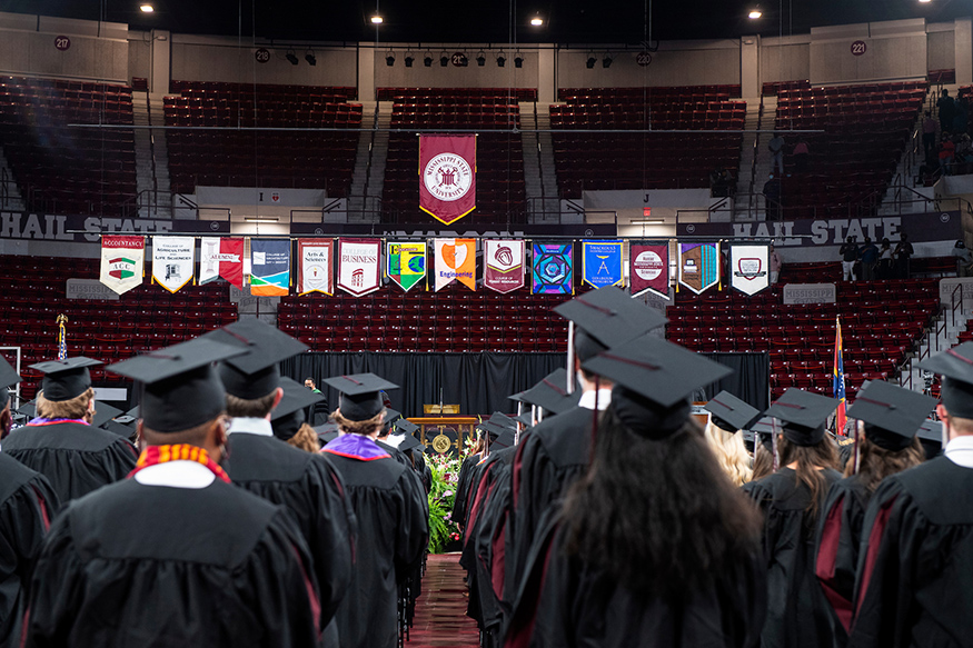 Banners representing MSU's eight academic colleges hang in Humphrey Coliseum during spring commencement ceremony
